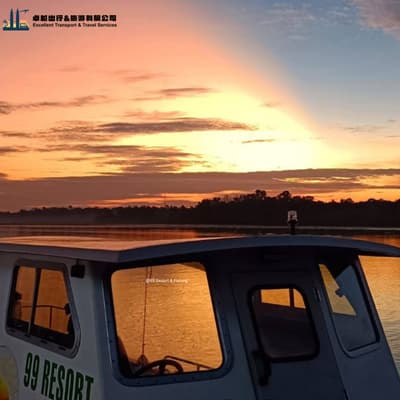 Fish ponds and wooden walkway at 99 Resort Fishing kelong Johor at sunset